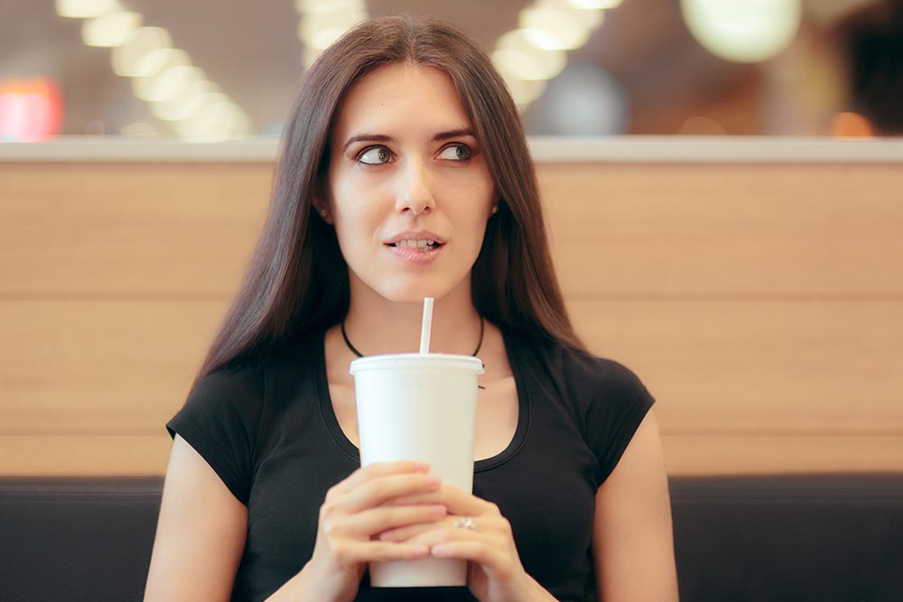 Woman drinking soda